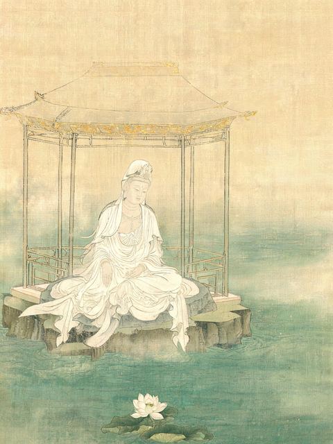 Ink painting on silk: the Bodhisattva Guanyin in plain white sits in an open pavilion above a jade-green sea, a lotus at the waterline below.